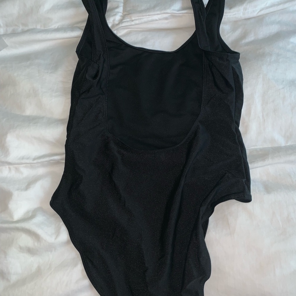 Black ‘SQUAD’ one piece bathing suit. Never worn!